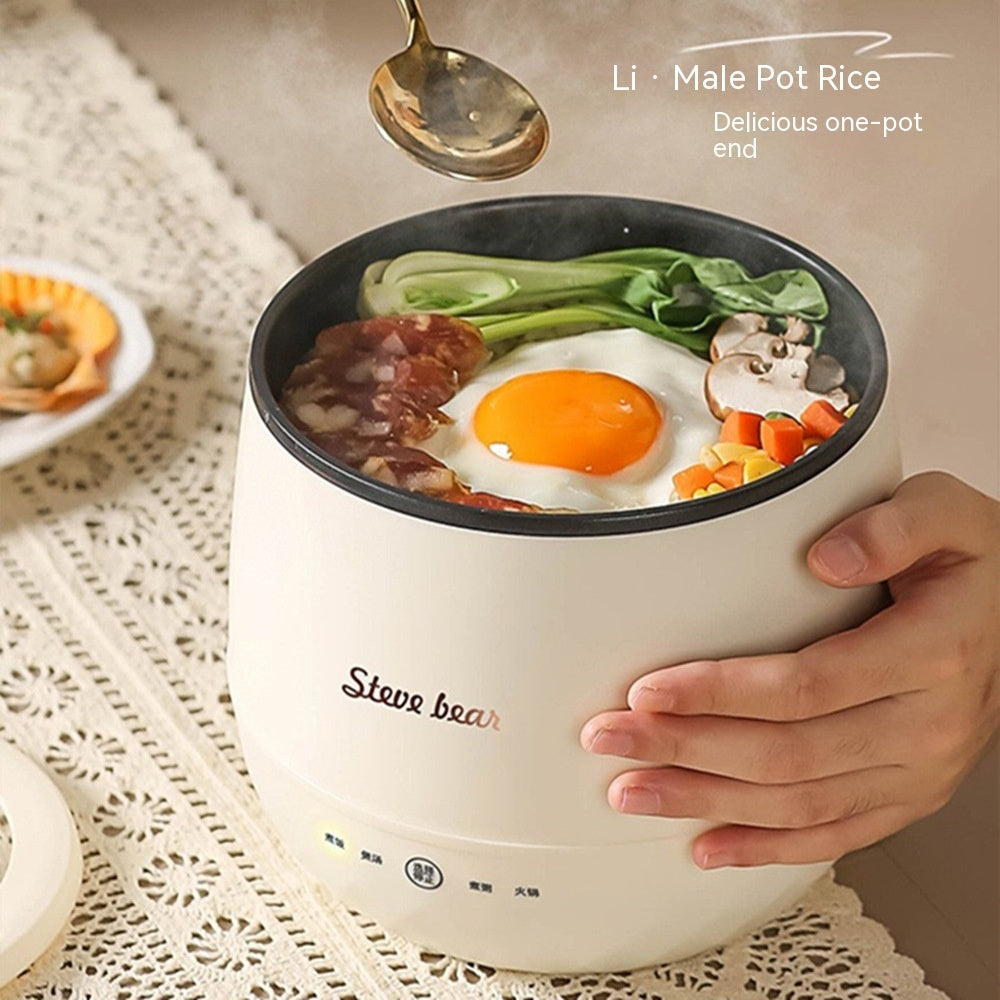 Household mini multi-function rice cooker with cooked meal and spoon.