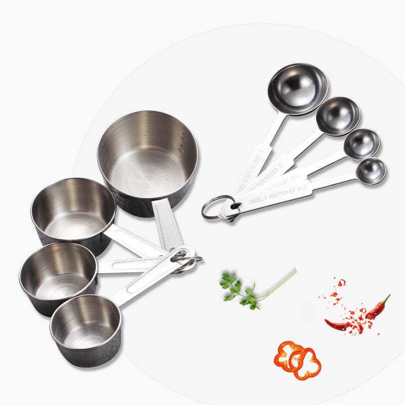 Stainless steel baking measuring spoon set with multiple capacities for accurate measurement.