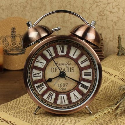 Retro creative alarm clock with antique style, round bronze design, and luminous pointer display.