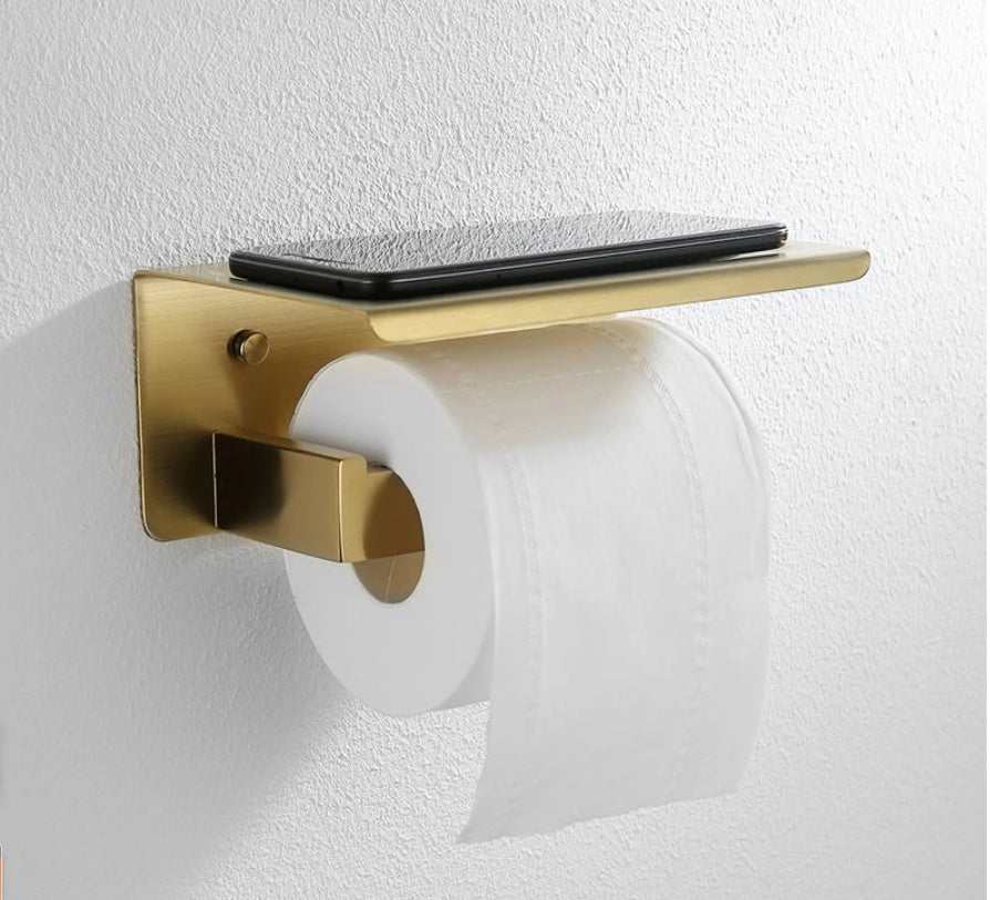 Golden stainless steel wall-mounted toilet paper holder with phone shelf, modern bathroom hardware set.