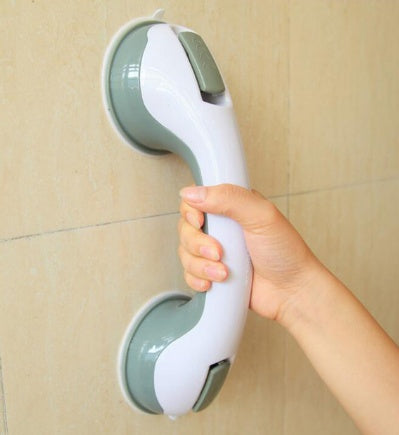 Suction cup bathroom handrail in use on a tiled wall.