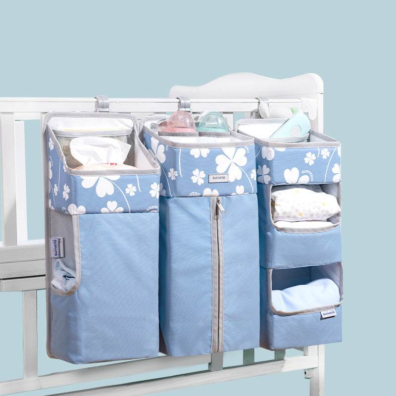 Blue four-leaf clover design baby bed storage hanging bag, wall-mounted, non-woven material.
