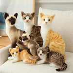 Realistic cat plush toys on a sofa, featuring various breeds with soft ppcotton filling.
