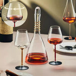 Fancy decanter cup with rotational goblets, modern simplicity design.