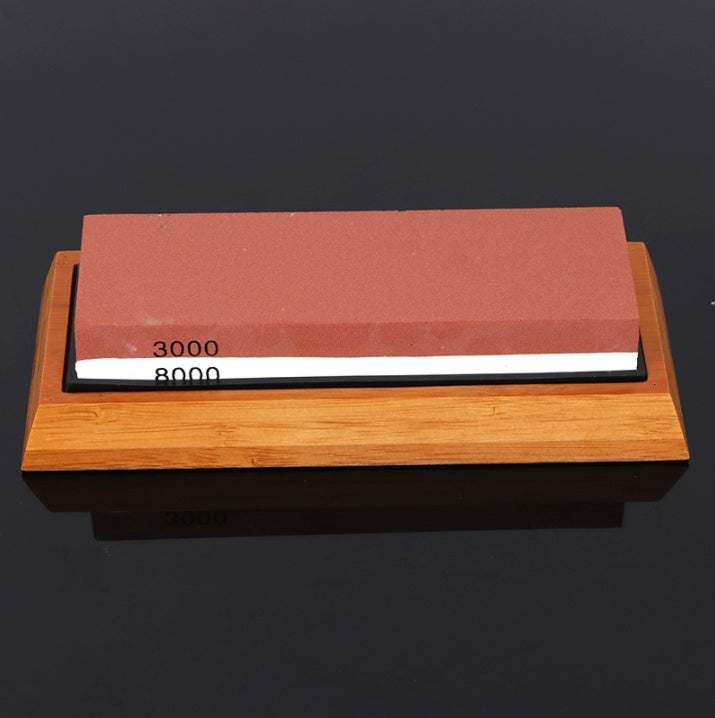 Home kitchen whetstone with bamboo base, featuring 3000/8000 grit for knife sharpening.