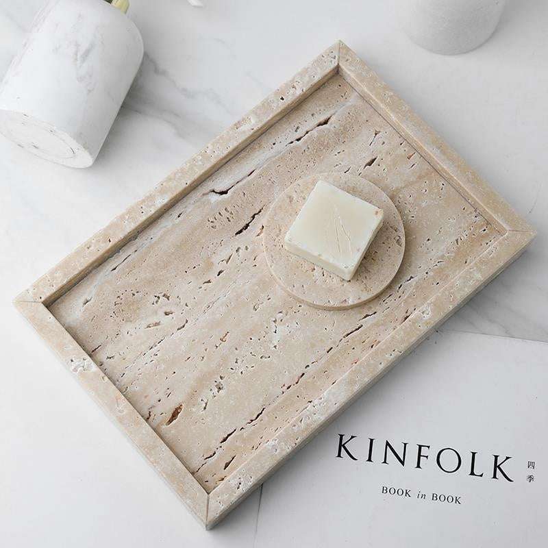 Modern stone dining tray with rectangular design and natural texture.