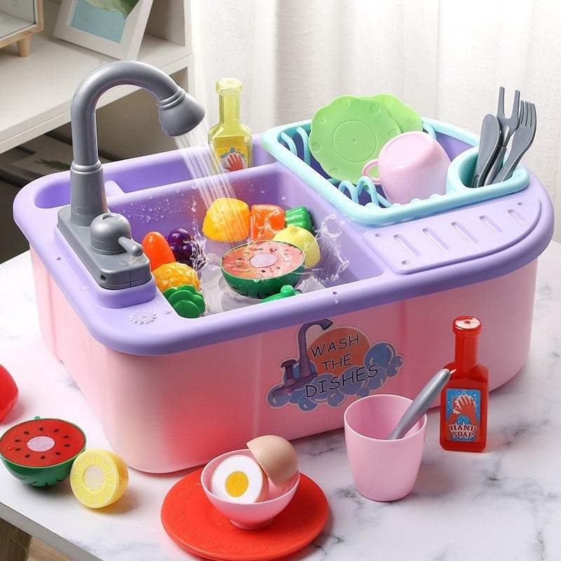 Toy dishwasher set with colorful plastic dishes and utensils, pink version.