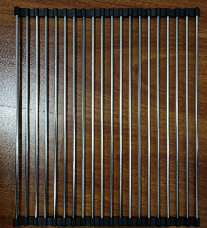 Folding kitchen drain sink rack made of stainless steel with multiple tubes, placed on wooden surface.