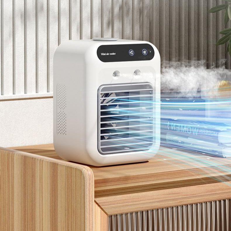 Portable air conditioner in ivory white with touchscreen, emitting cool air on wooden surface.