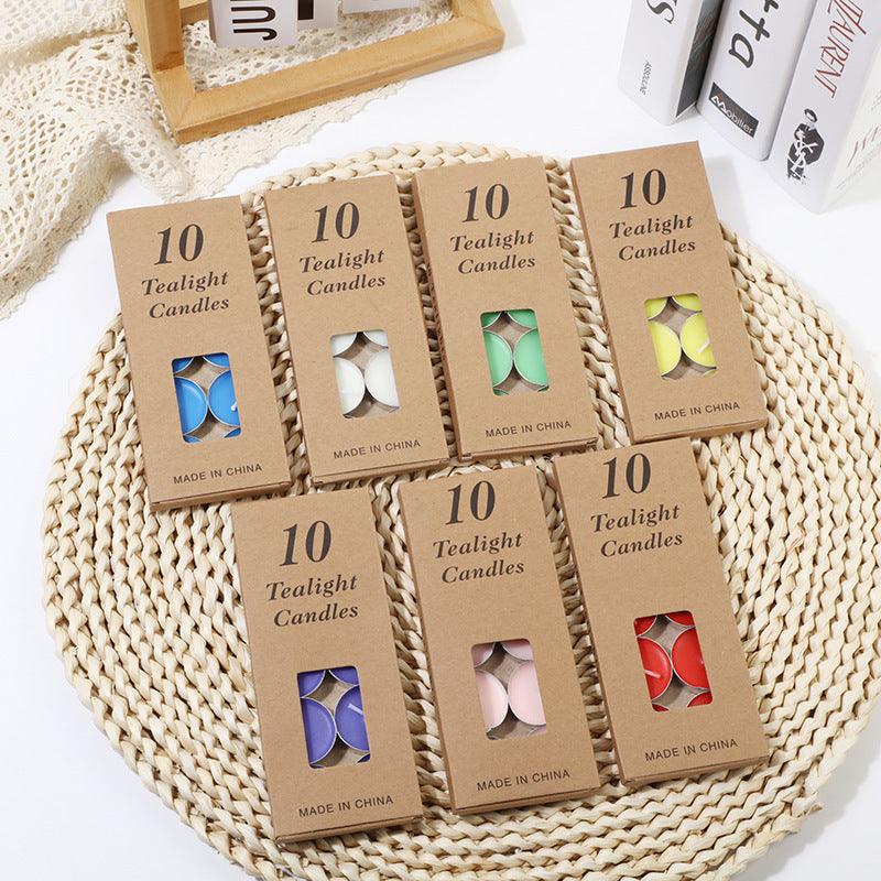 Candle Aluminum Shell Tea Wax Set in various colors, 10-pack boxes displayed on a woven mat.